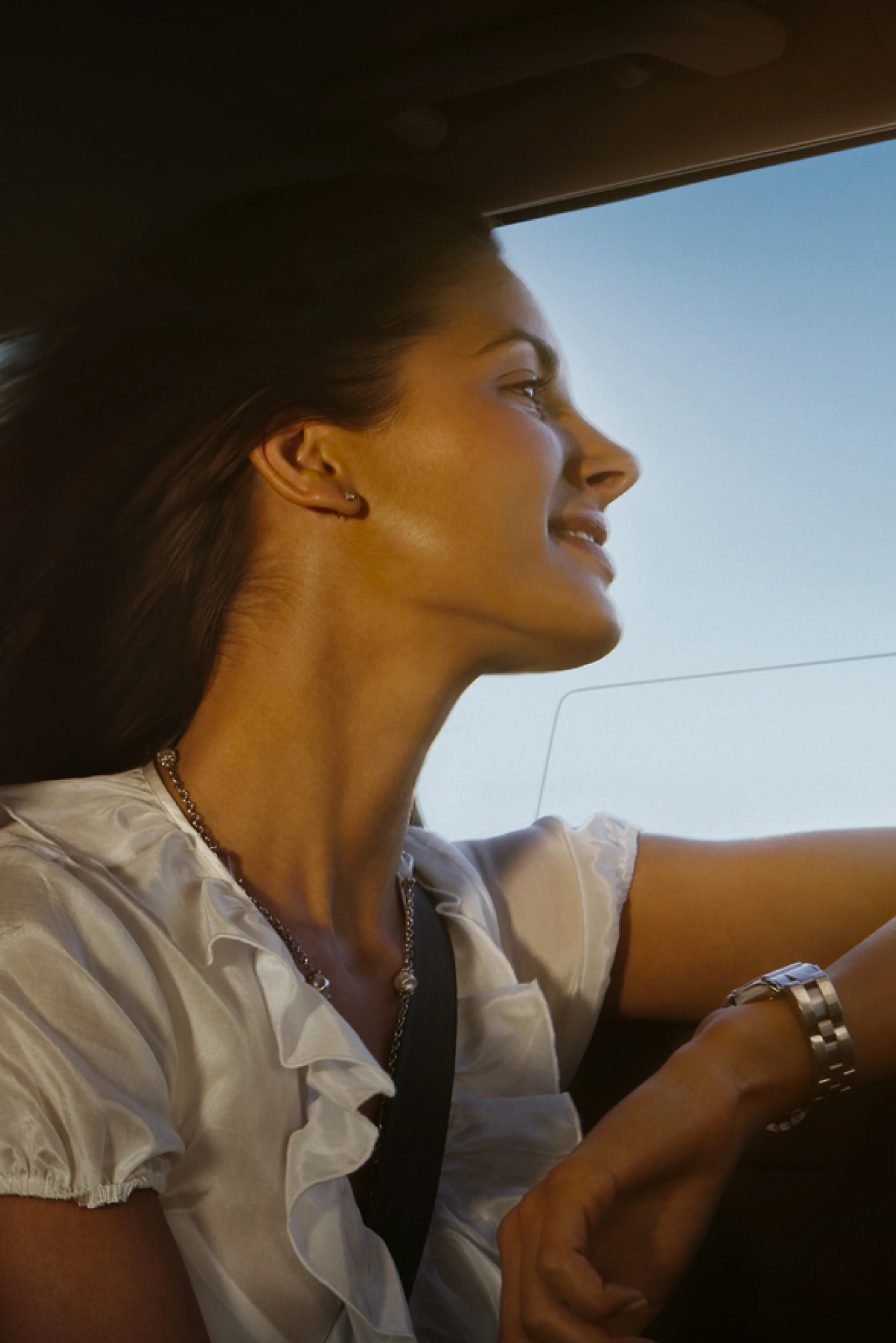 Two women in a car enjoying a drive