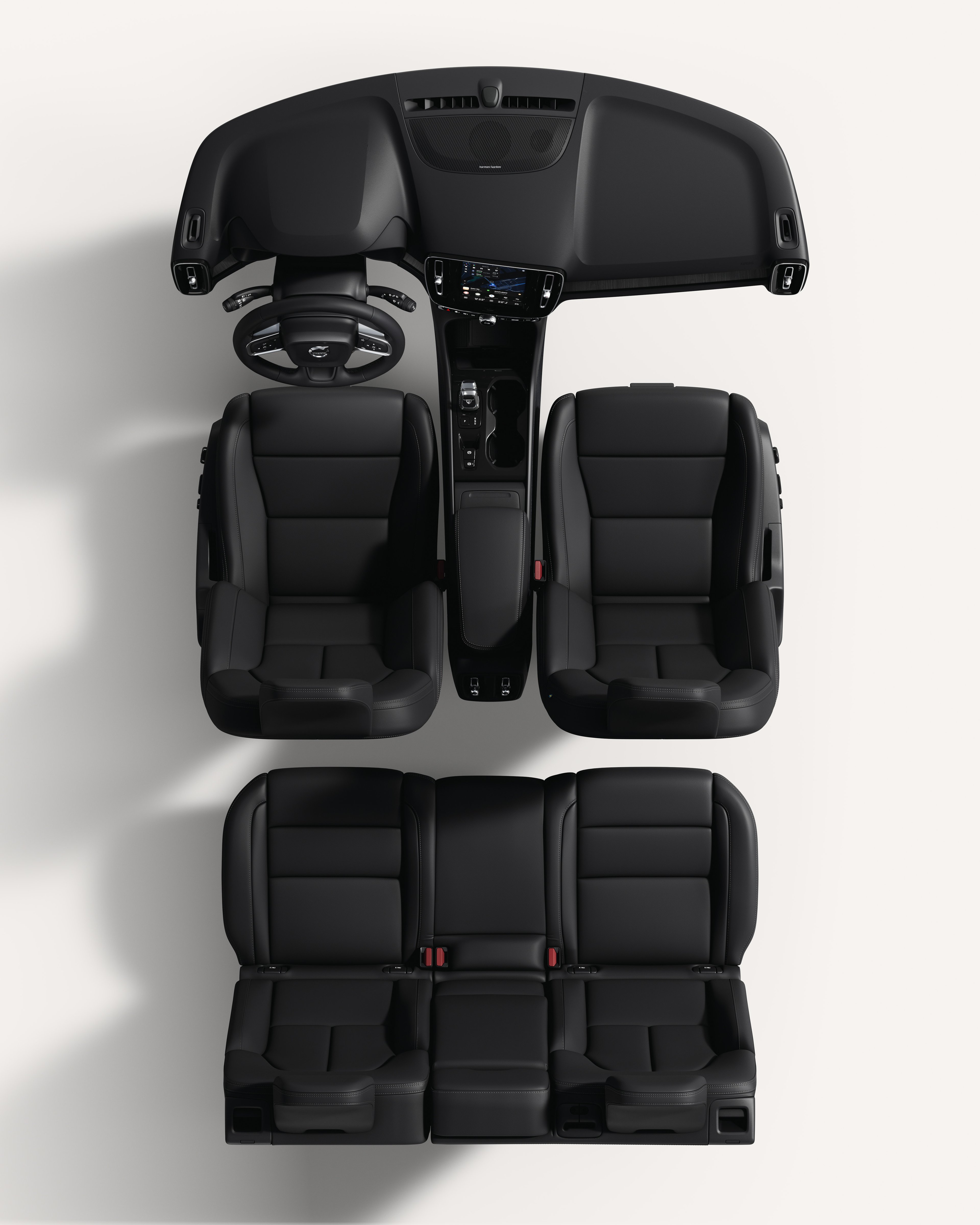 白色摄影棚内沃尔沃 XC40 内部座椅和中控台俯视图。