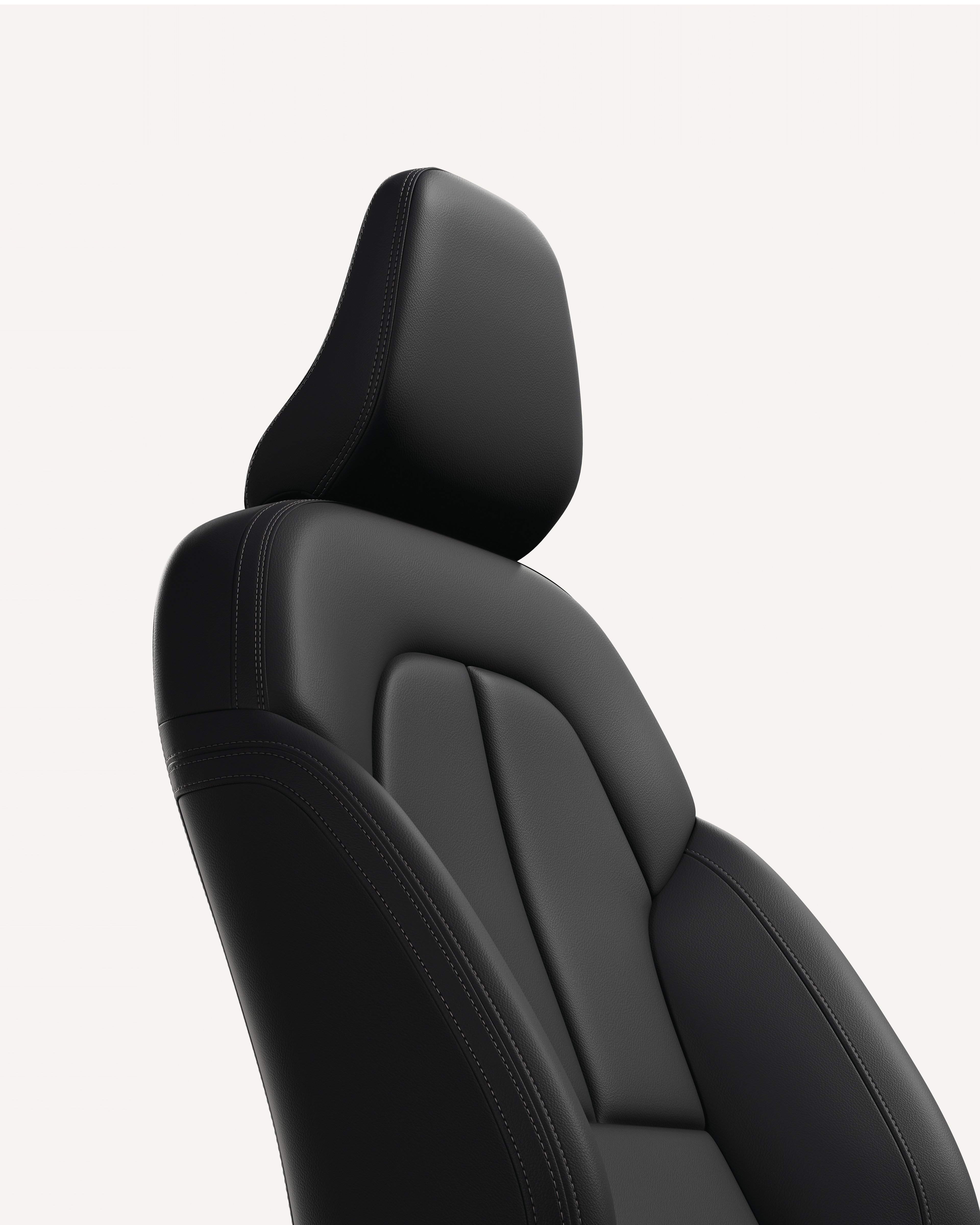 白色摄影棚内沃尔沃 XC40 前排座椅内饰特写。