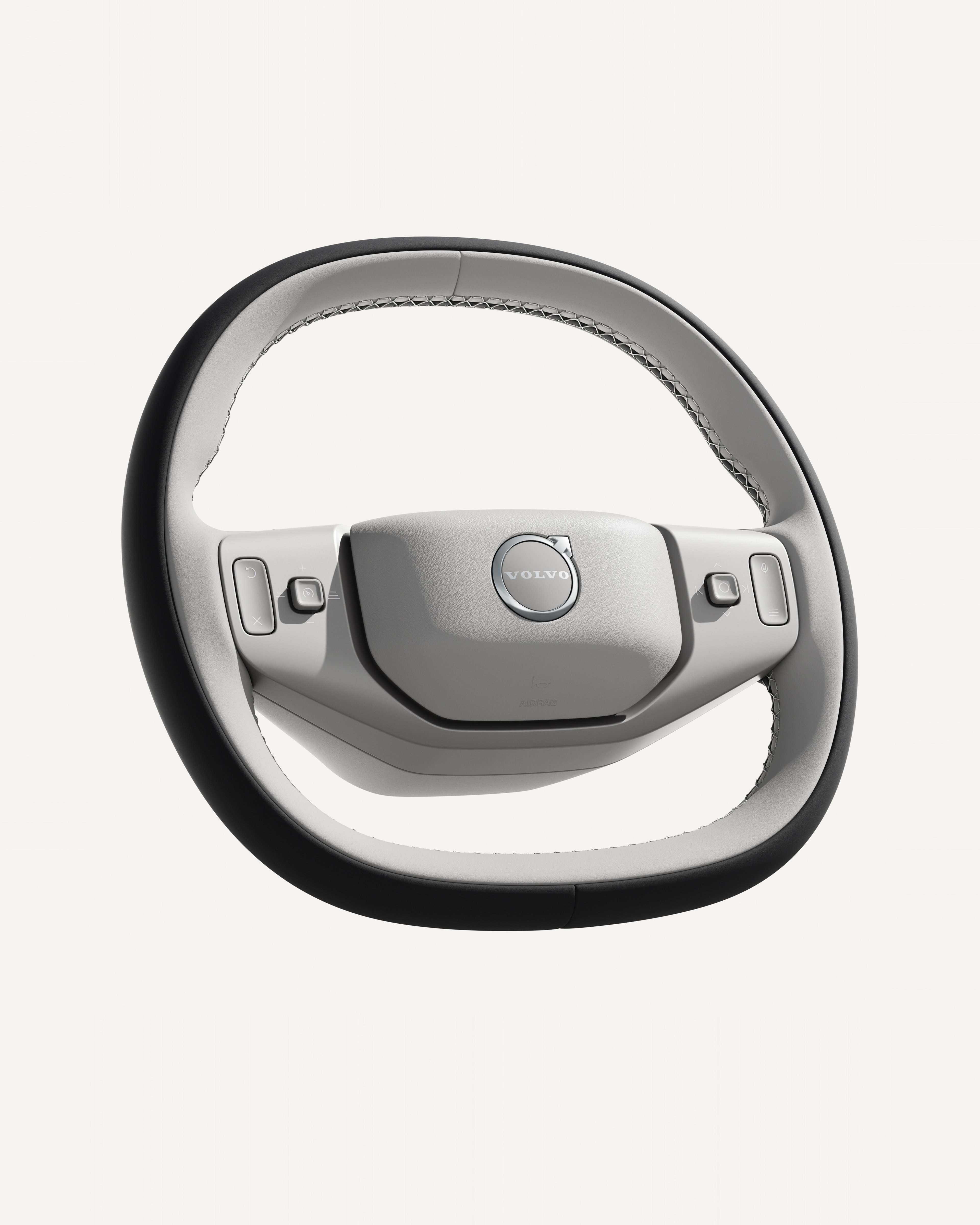 沃尔沃 XC70 方向盘特写,展示其集成控件。