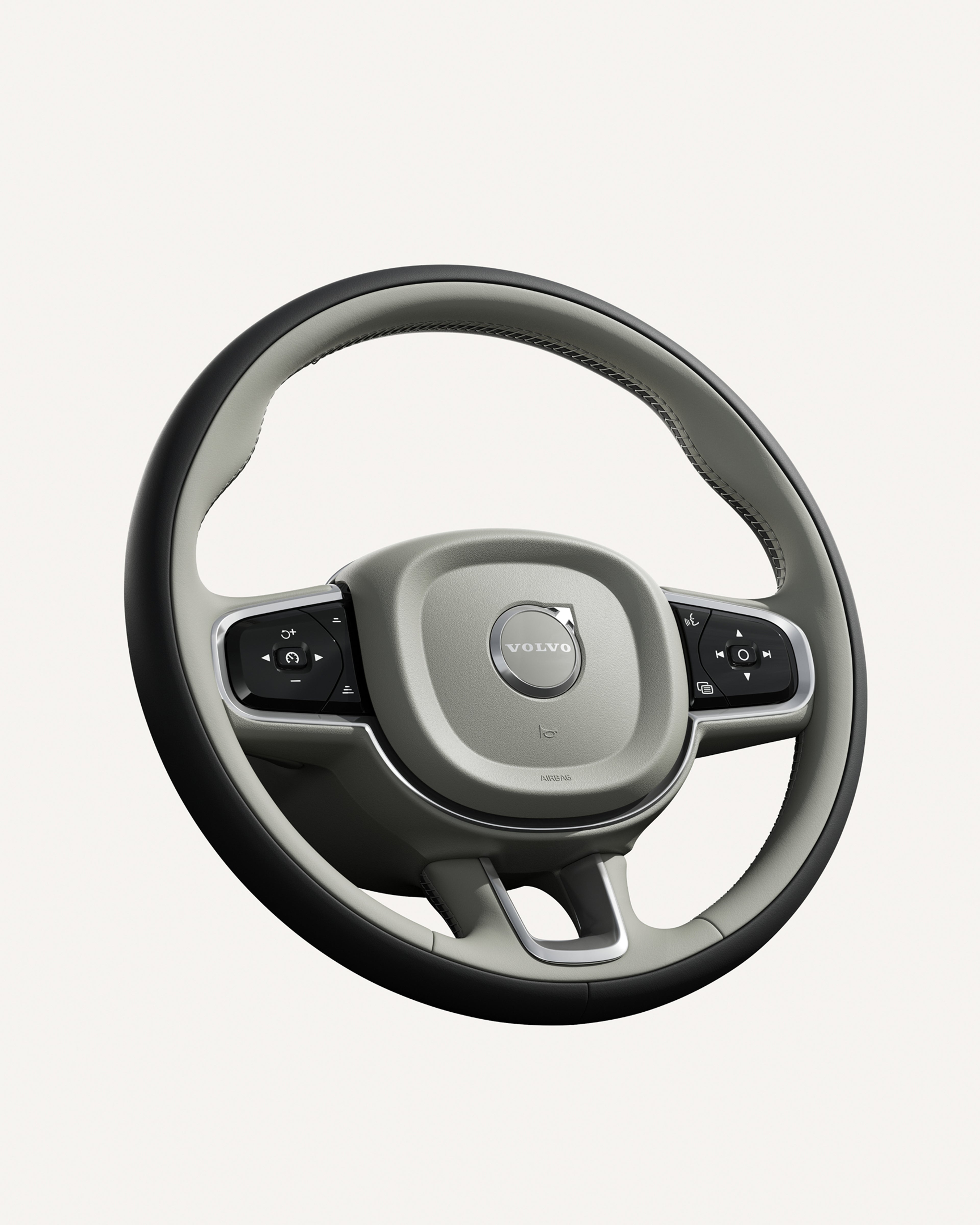 沃尔沃 S90 方向盘特写,突显其集成控制开关。