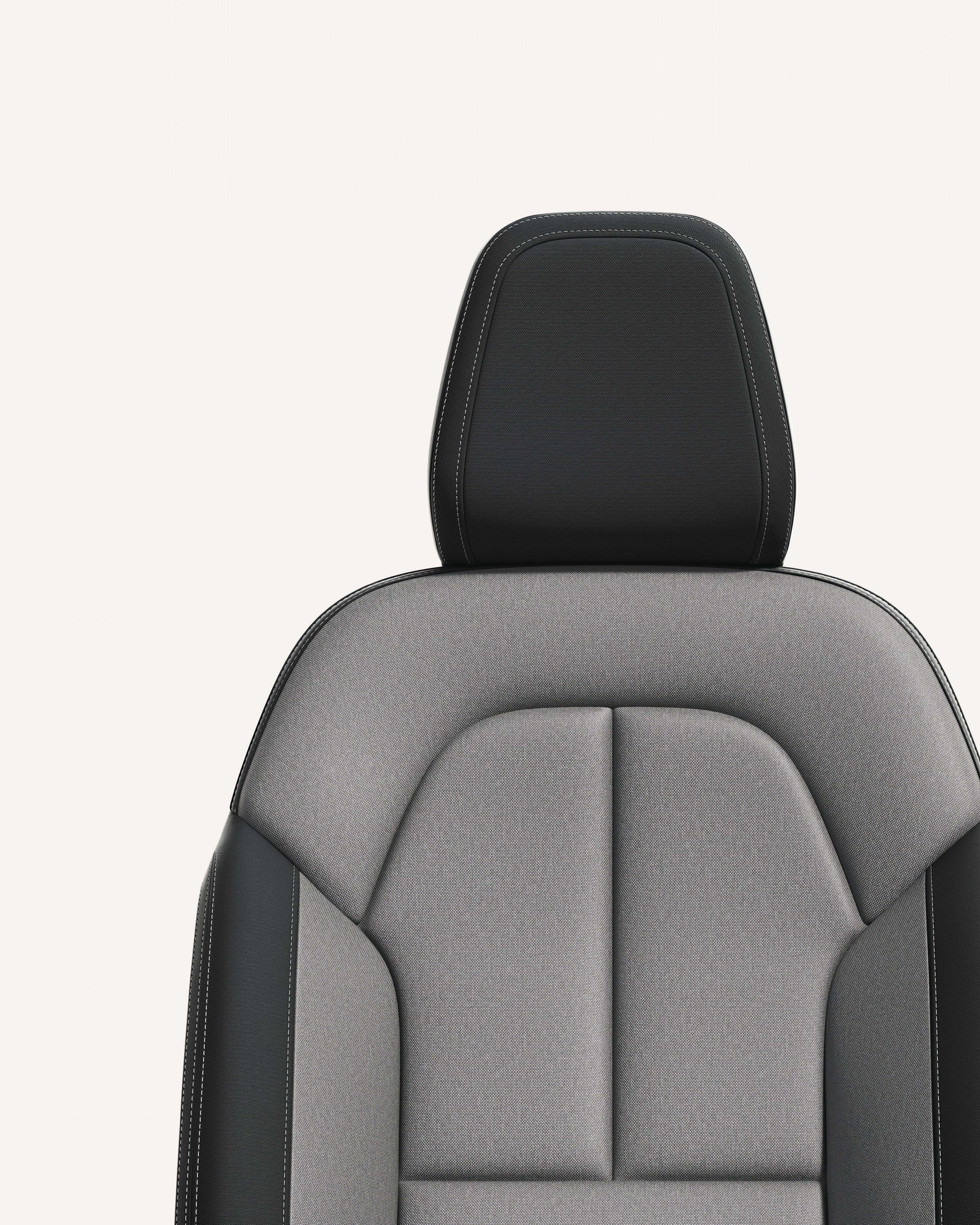 白色摄影棚内混灰色沃尔沃 XC40 前排座椅内饰特写。