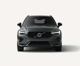 Front view of a dark grey Volvo XC60 SUV with LED headlights and the Volvo logo prominently displayed on the grille.