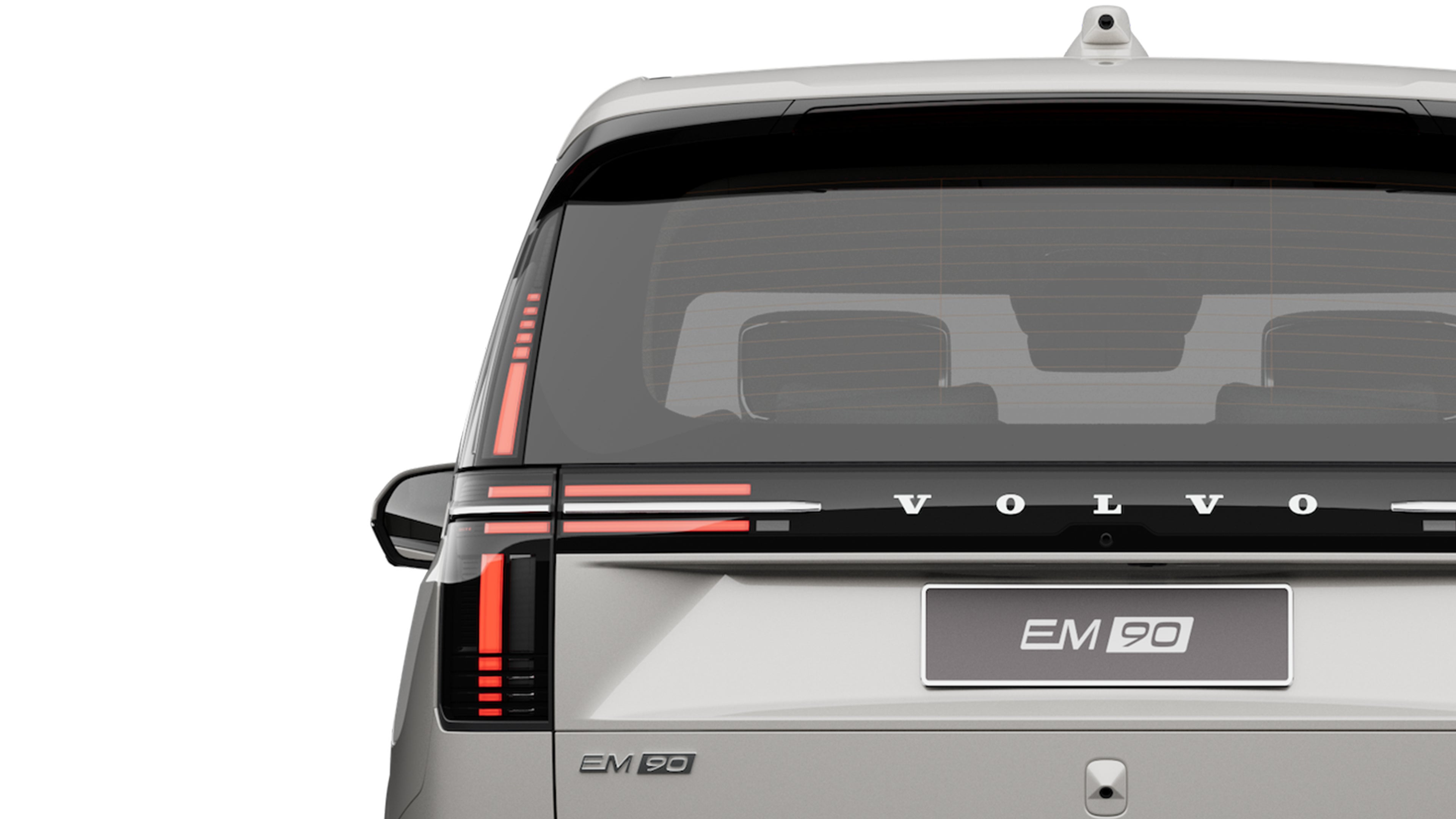 一辆鎏金沙沃尔沃EM90 纯电MPV静止停放。